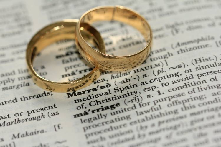 Couple reviewing divorce papers in attorney’s office