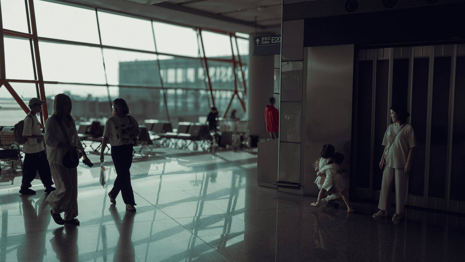 Family saying goodbye at the airport before relocation
