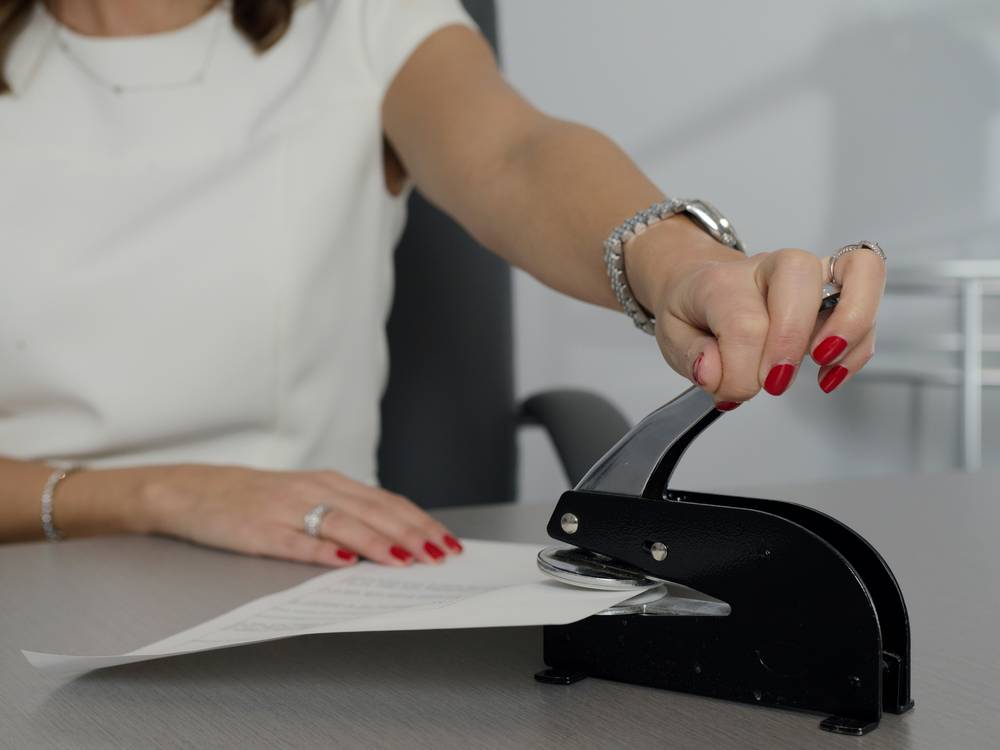 Process server handing divorce documents to respondent